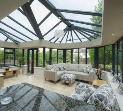 Interior of an orangery conservatory extension with kitchen counter and modern furniture