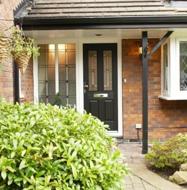 Modern, black composite door with two glass window panels