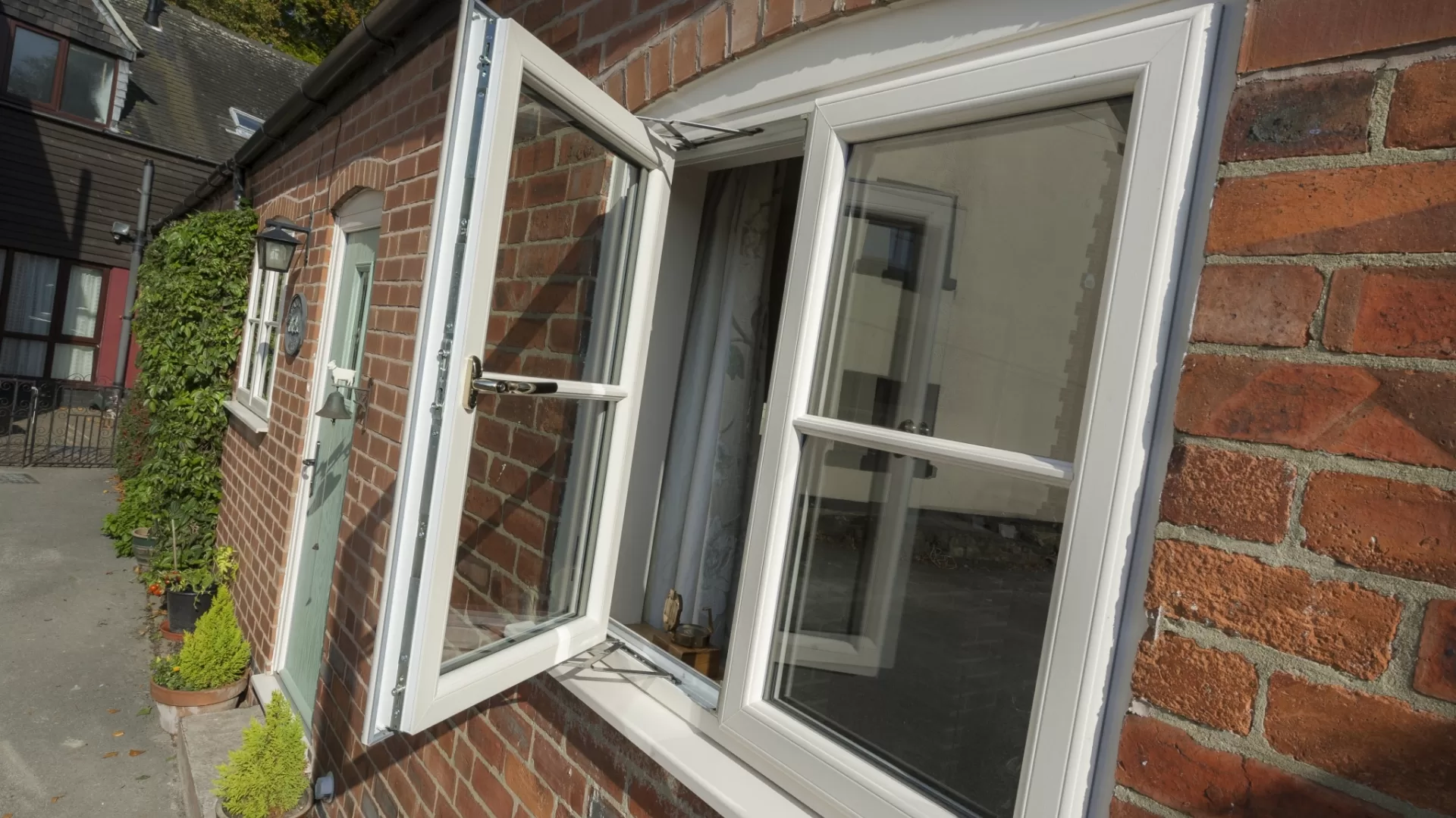 White uPVC casement window with two panels, one open